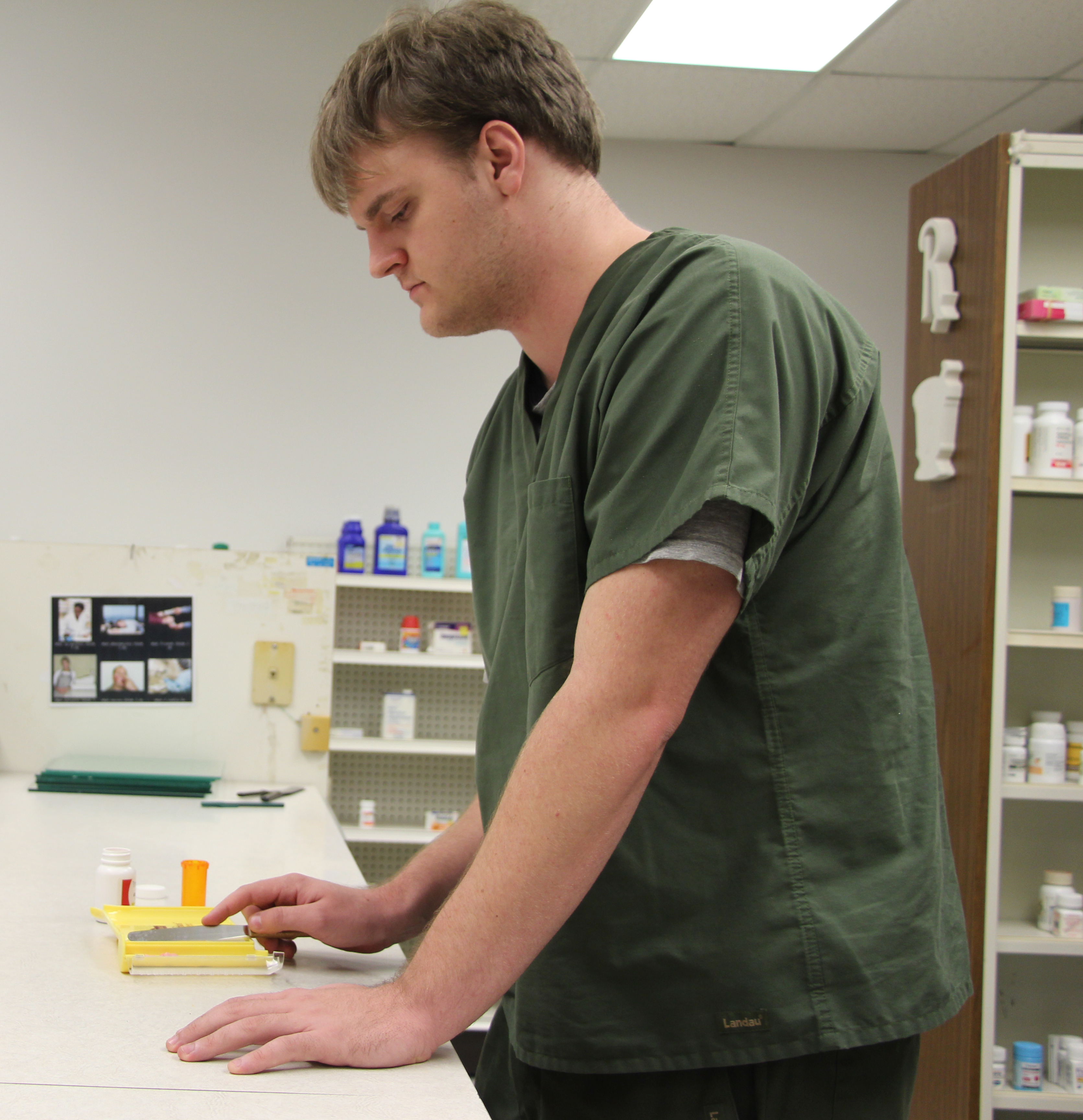ASU-Beebe Pharmacy Technician second-year student Blake Lucas of Cabot, practices counting Atenolol 50 mg tablets to fill a patient order.