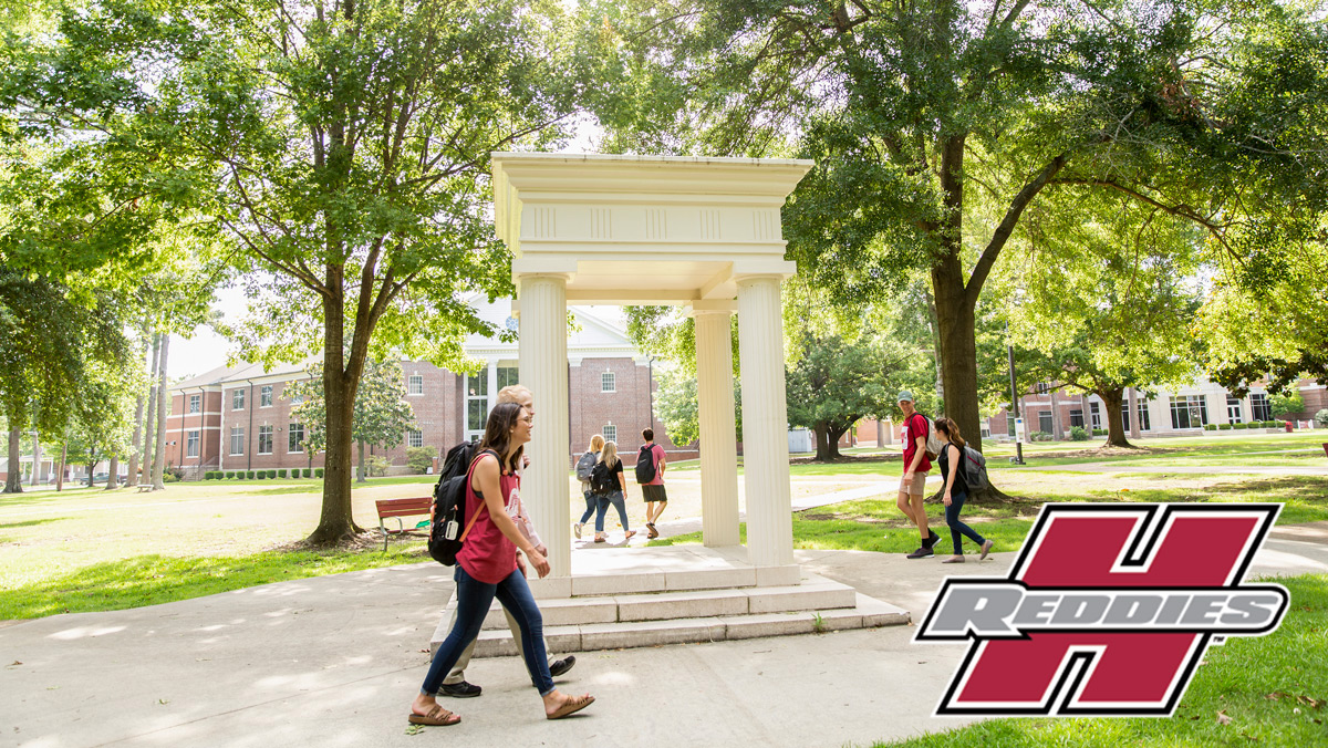 Students walking across the South Lawn at Henderson